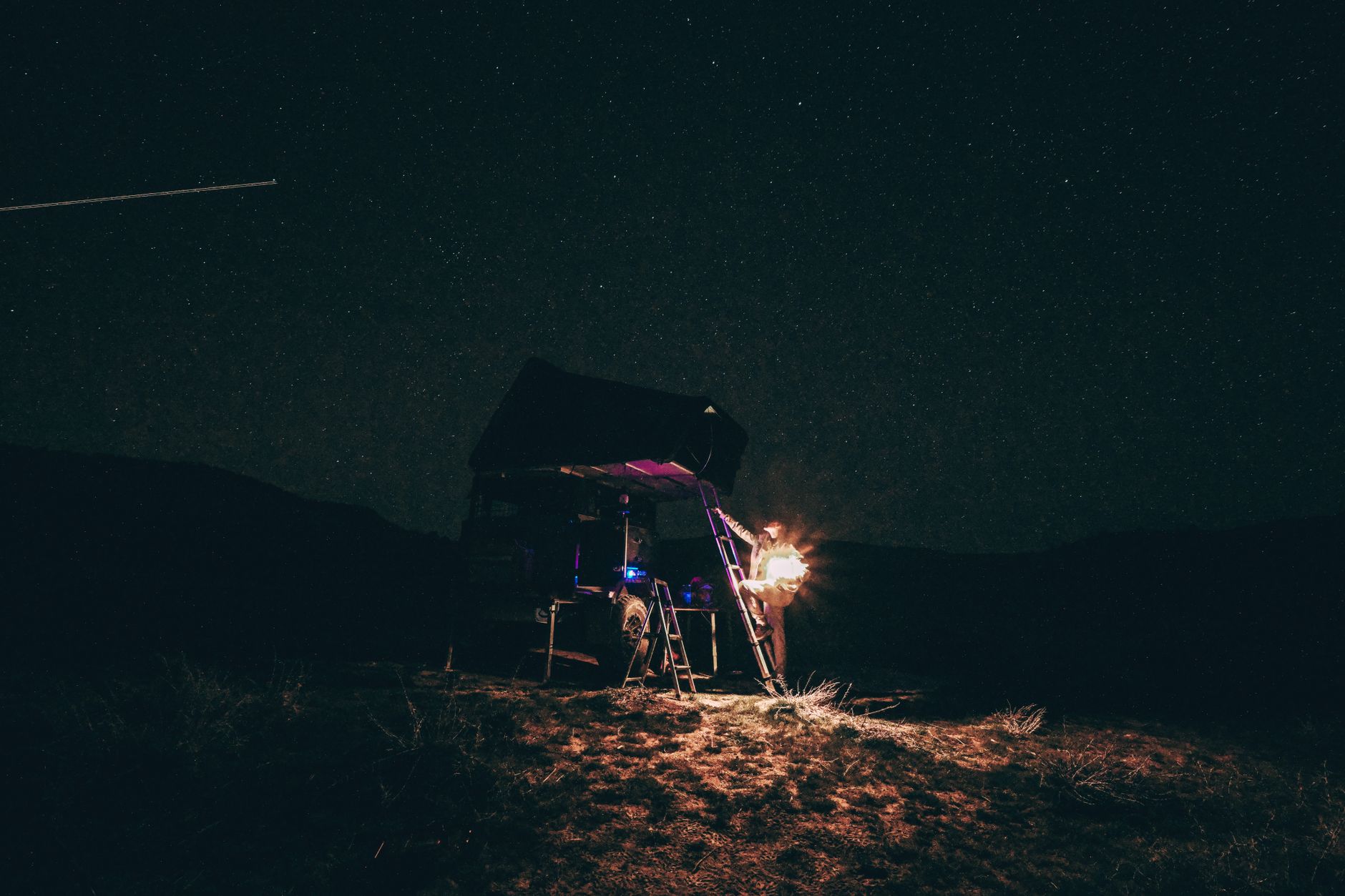 Tent pitched on open moorland at night illustrating wild camping UK mental health benefits